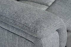Close-up of the Linden recliner's padded gray arm and stitched upholstery