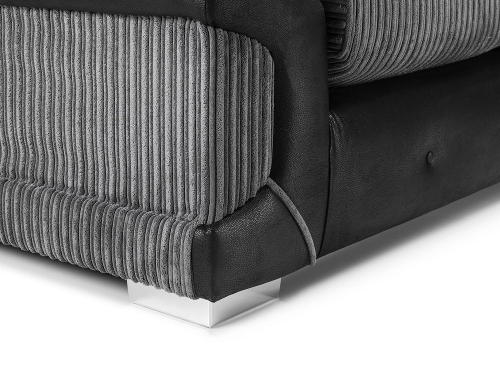 Logan Fullback armchair corner detail showing gray ribbed fabric, black trim, and chrome foot