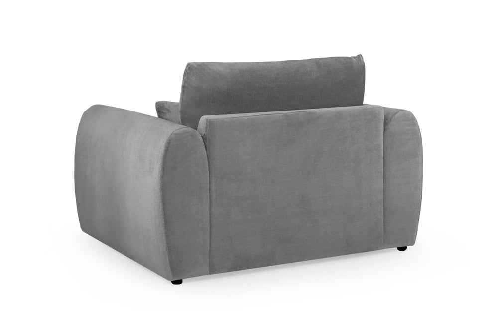 Gray Mirabel armchair viewed from the back, showing its upholstered rear panel and rounded arms