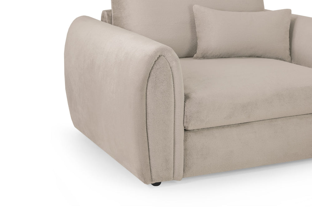 Mirabel armchair close-up of the rounded upholstered arm and cushioned seat