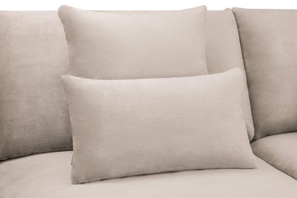 Rectangular beige scatter cushion against the sofa back cushions
