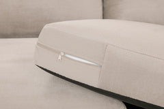 Close-up of a sofa seat cushion with a zippered cover