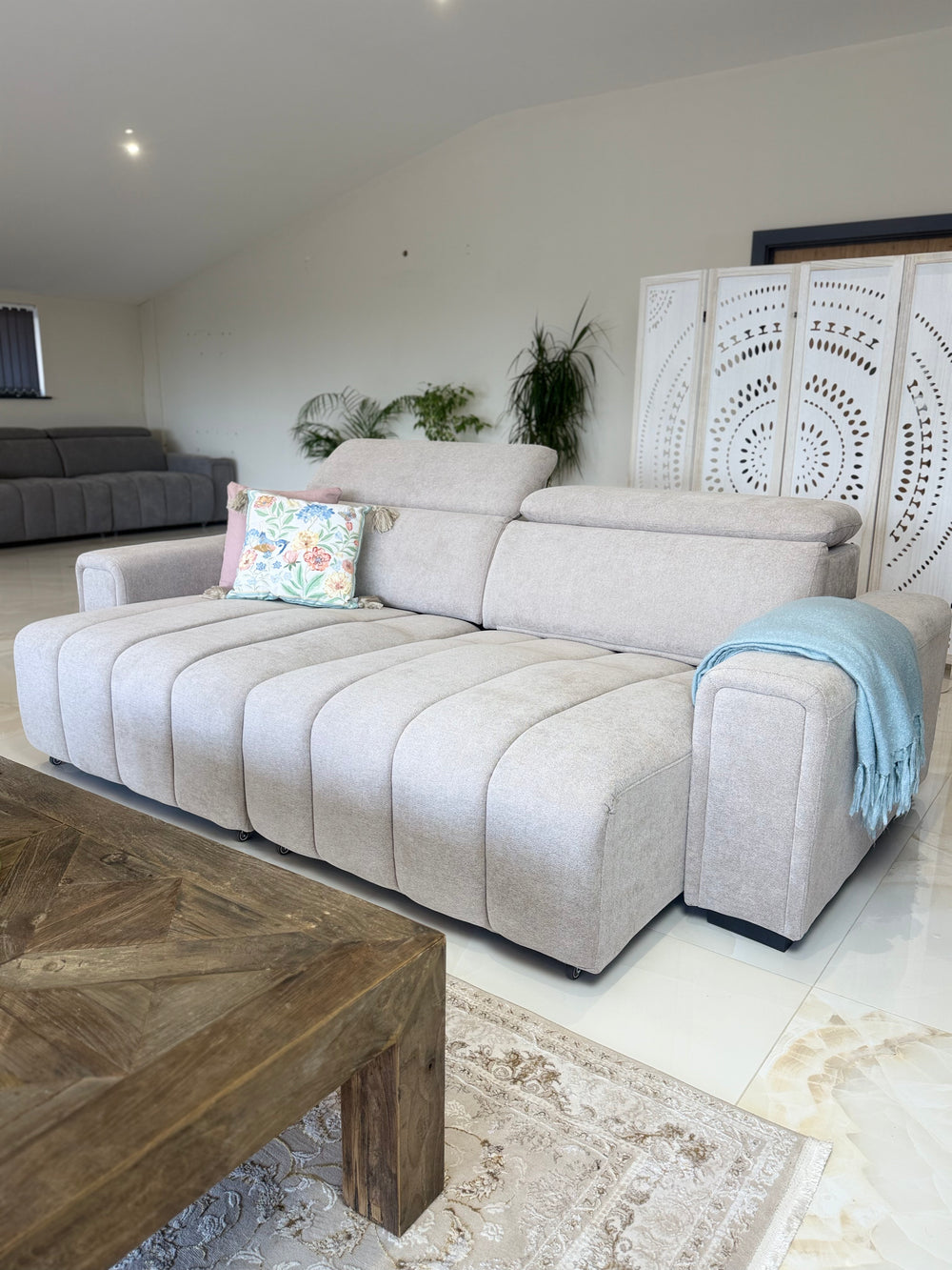 Molly electric sofa bed with one extended seat section and raised backrests