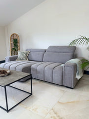 Gray three-seat electric sofa bed with raised adjustable headrests