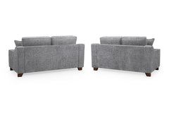 Nebraska gray sofas shown from the back with upholstered panels and dark wood feet