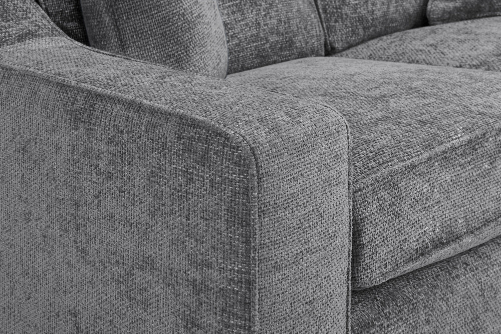 Nebraska sofa close-up of the textured gray upholstery and padded arm
