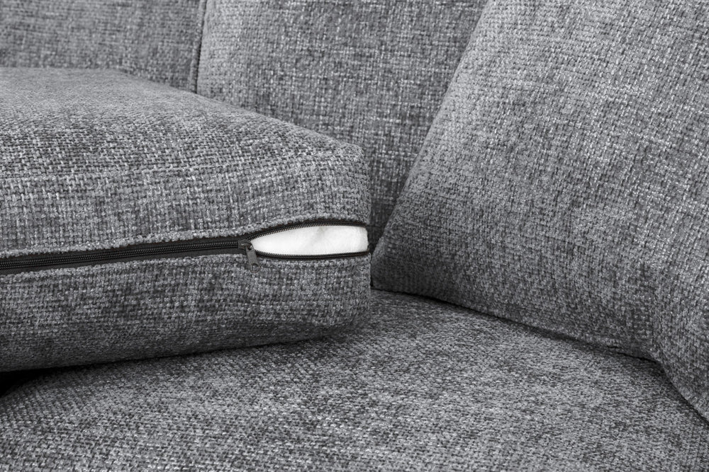 Gray armchair cushion with a visible zipper and white filling