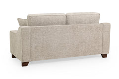 Nebraska three-seat sofa, showing its upholstered back and dark wood feet