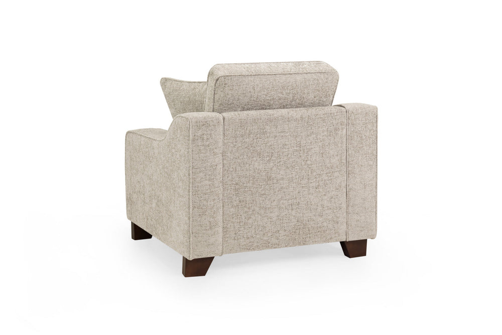 Nebraska Fullback armchair shown from the back, with beige upholstery and dark wood legs
