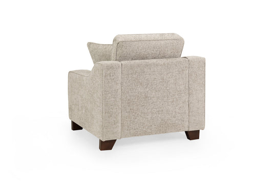 Nebraska Fullback armchair shown from the back, with beige upholstery and dark wood legs
