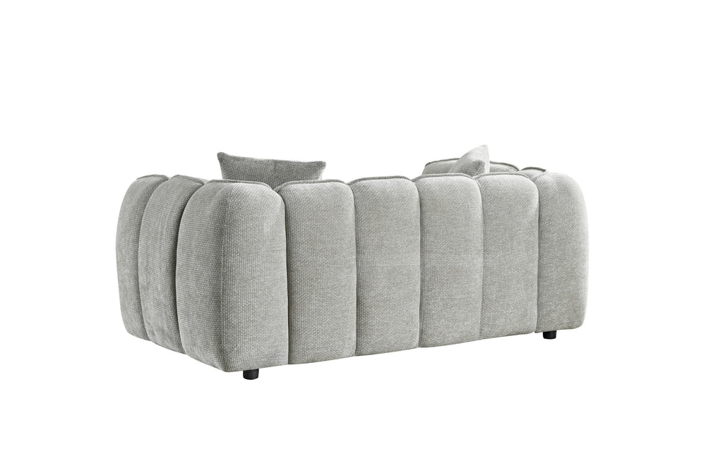 Two-seat sofa viewed from the back, with rounded channel upholstery and short black legs