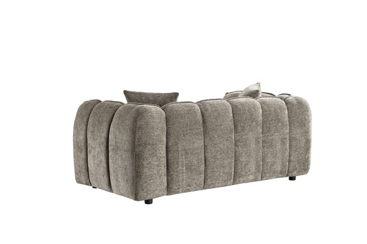 Venice two-seat sofa viewed from the back, showing its rounded channel-stitched upholstery
