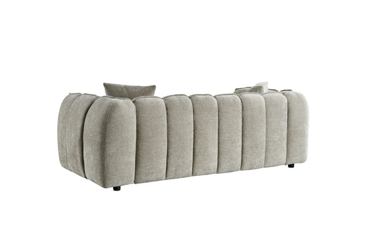 Venice three-seat sofa viewed from the back, with vertical upholstered channels and short black legs