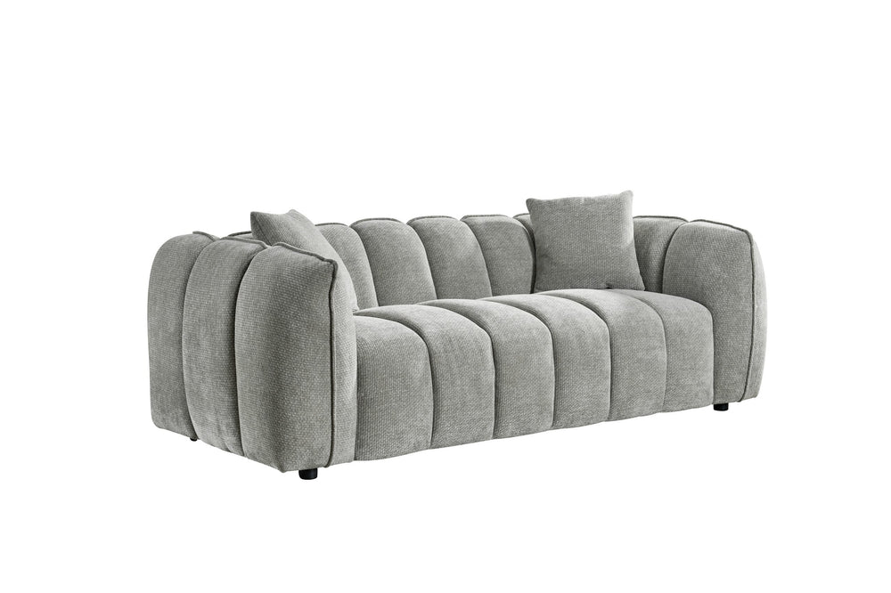 Venice three-seat sofa in light gray textured fabric with channel tufting and loose cushions