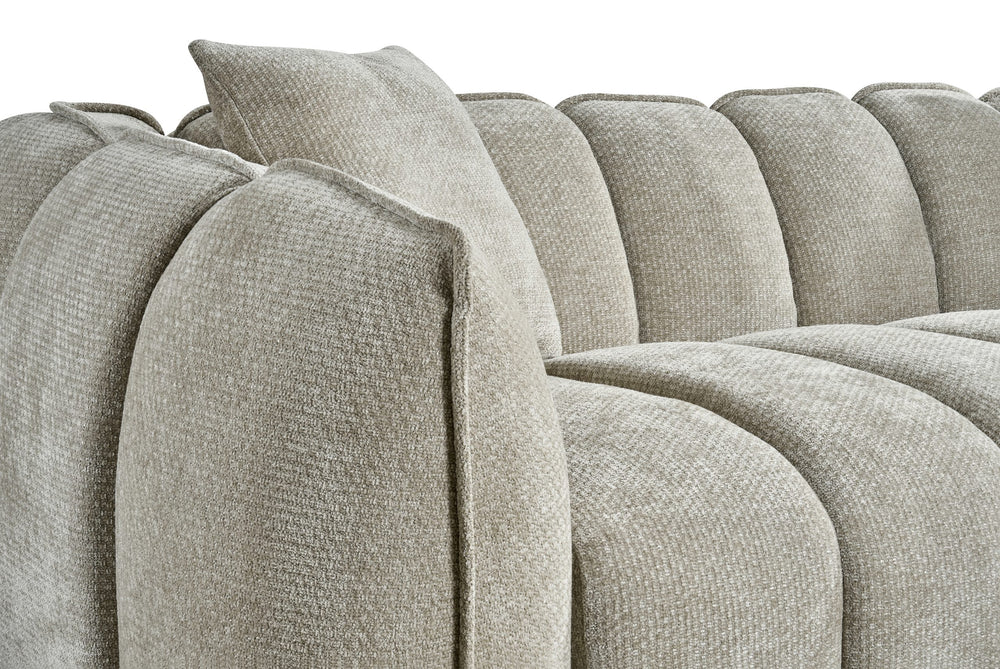 Venice sofa close-up showing its rounded arm, segmented back, and textured upholstery
