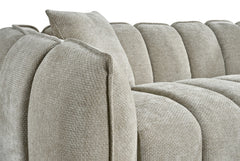 Venice sofa close-up showing its rounded arm, segmented back, and textured upholstery