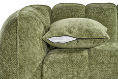 Sofa cushion with a visible zipper, beside the rounded arm and textured green upholstery