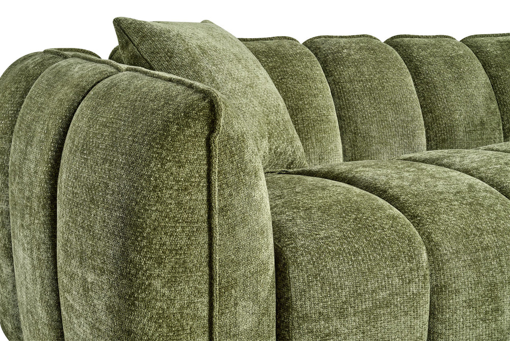 Close-up of the sofa's rounded arm, back panels, and seat cushions in textured green fabric