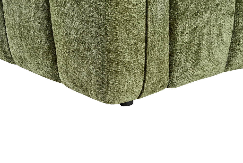Close-up of the sofa's upholstered base and short black foot