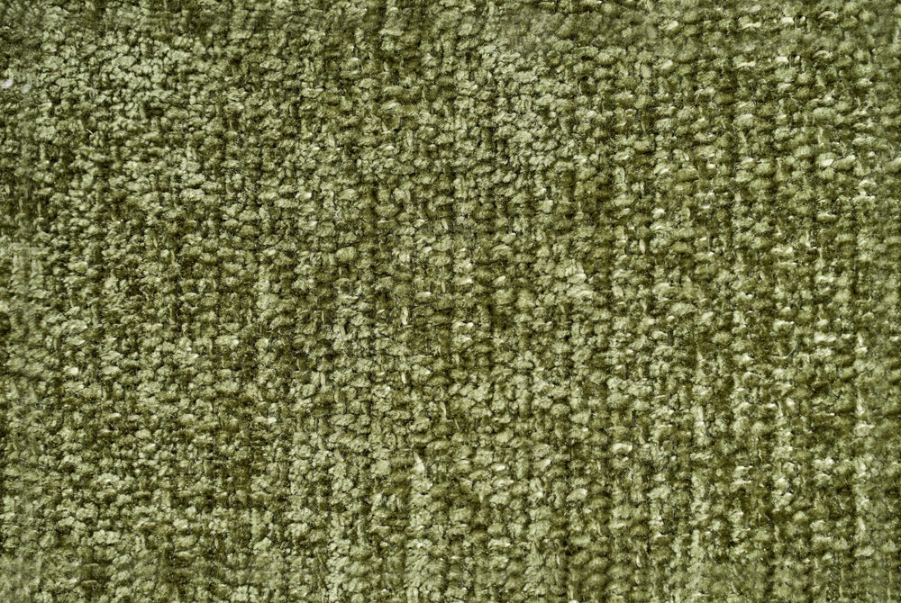 Close-up of the sofa's textured olive green upholstery
