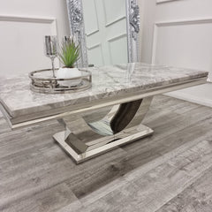 Grey marble coffee table with layered edging and a curved metal base