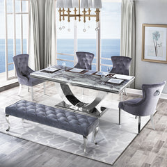 Arial dining table with gray veined top and chrome pedestal, paired with chairs and a bench