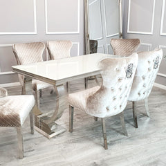 Arriana dining table with a glossy white top and polished metal loop legs