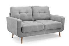 Aurora two-seat sofa in light gray fabric with tufted cushions and tapered wood legs