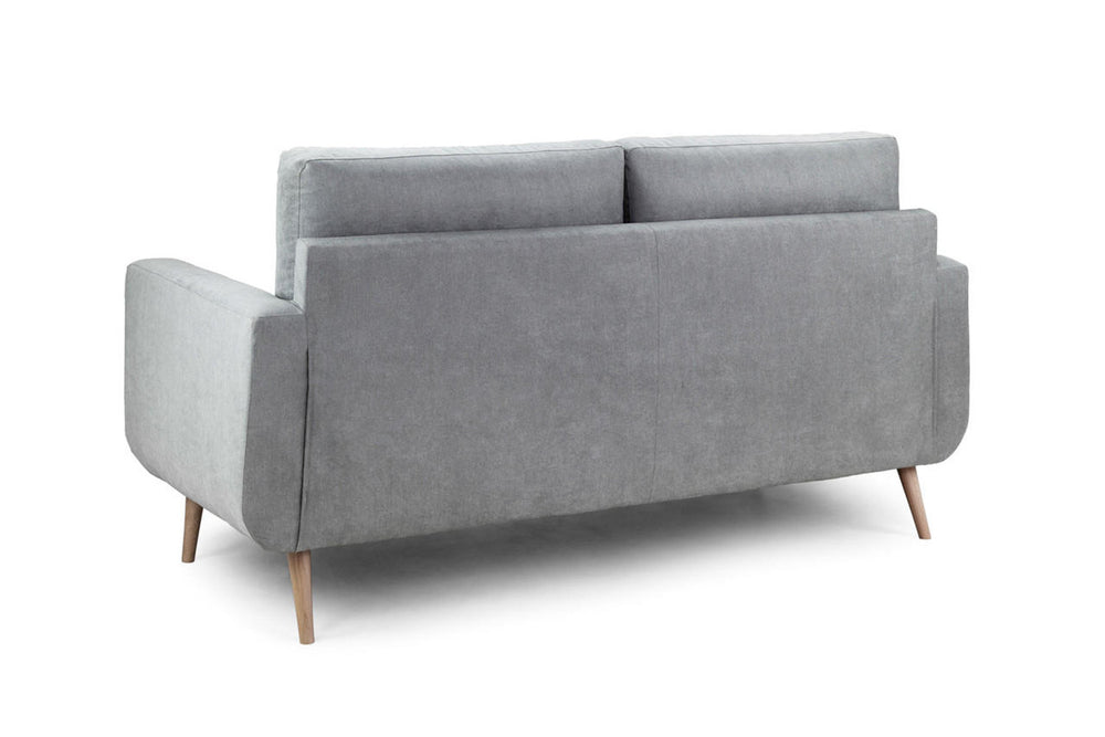 Aurora sofa viewed from the back, with a solid upholstered back and wooden legs