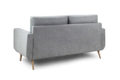 Aurora sofa viewed from the back, with a solid upholstered back and wooden legs