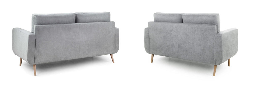 Two-seat sofa shown from behind, with broad arms and tapered wooden legs