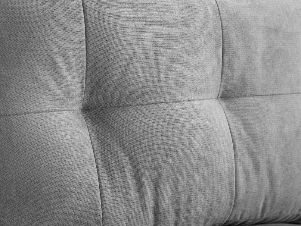 Aurora armchair close-up of stitched, tufted gray back cushion