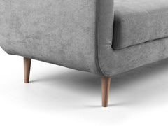 Aurora armchair detail showing gray upholstery, seat edge and tapered wood legs