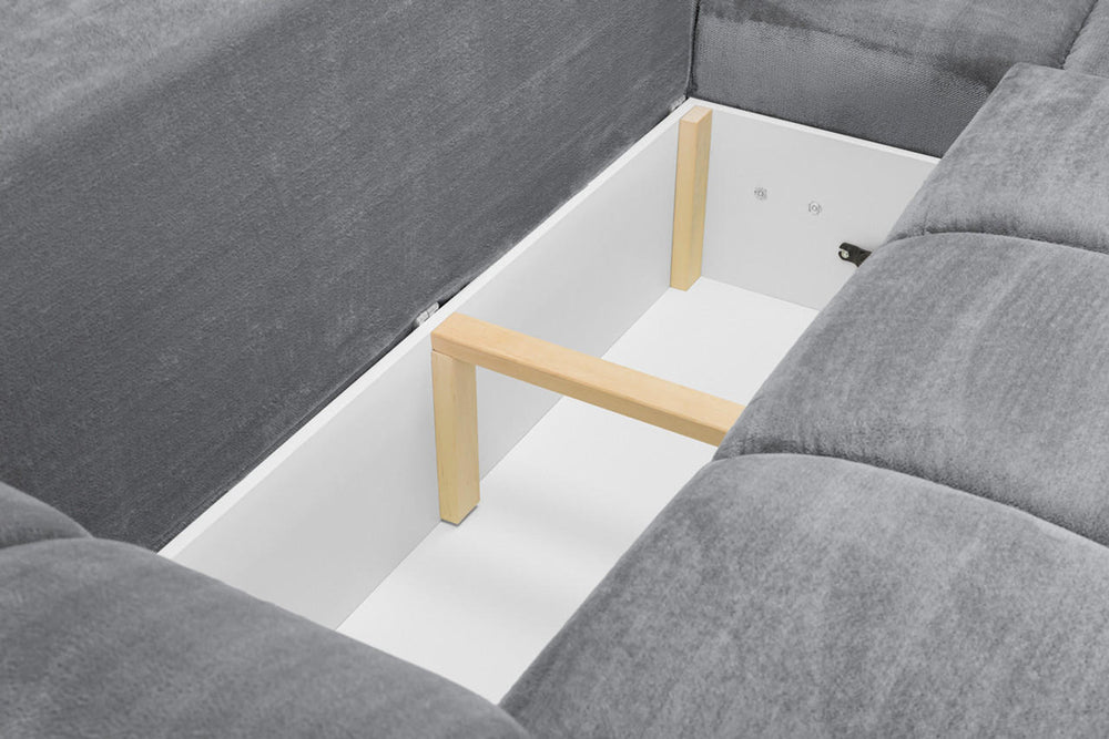 Interior frame and support structure visible beneath the grey sofa bed cushions