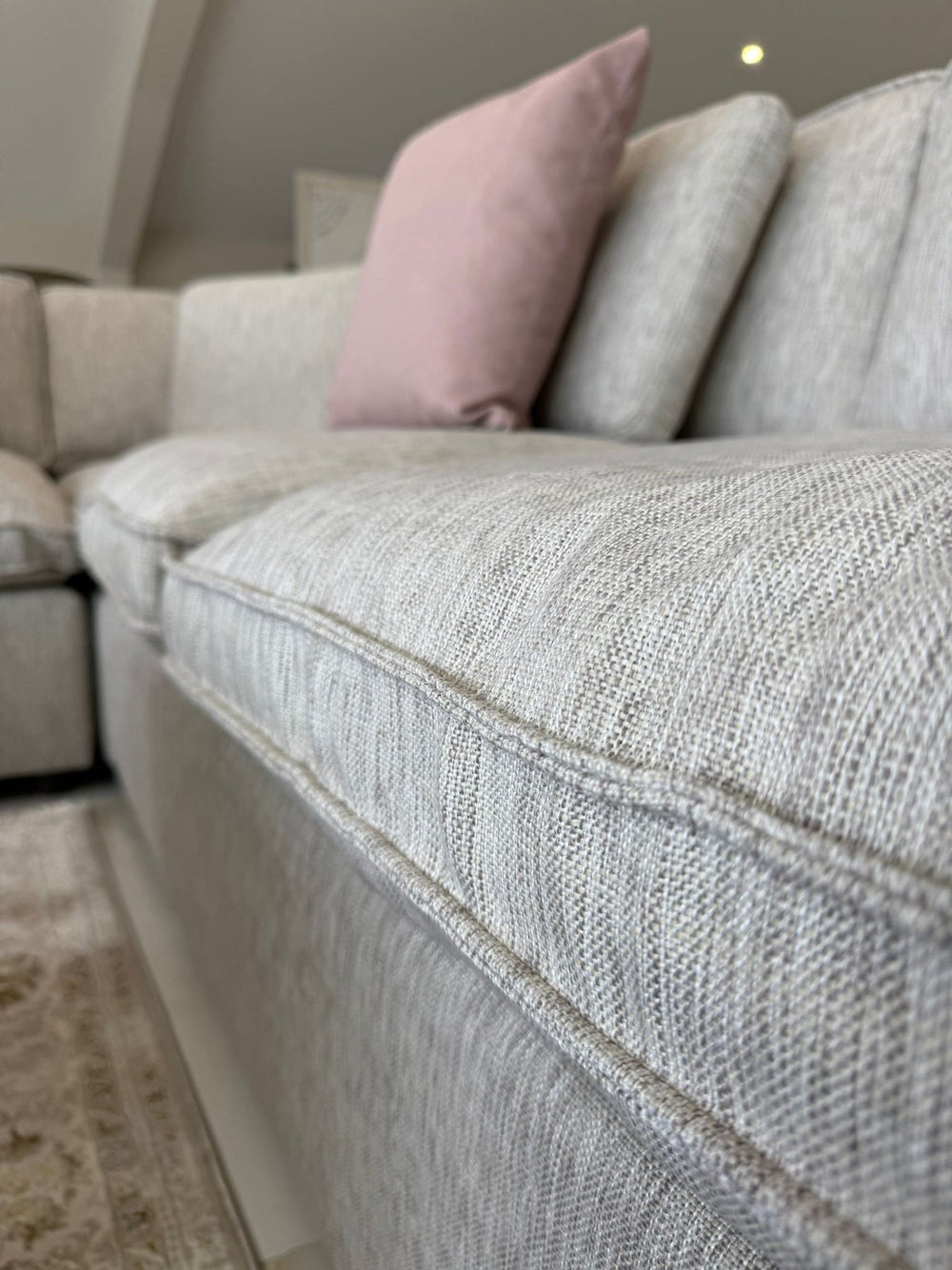 Close-up of the sofa's thick seat cushion and textured upholstery