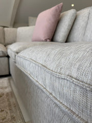 Close-up of the sofa's thick seat cushion and textured upholstery