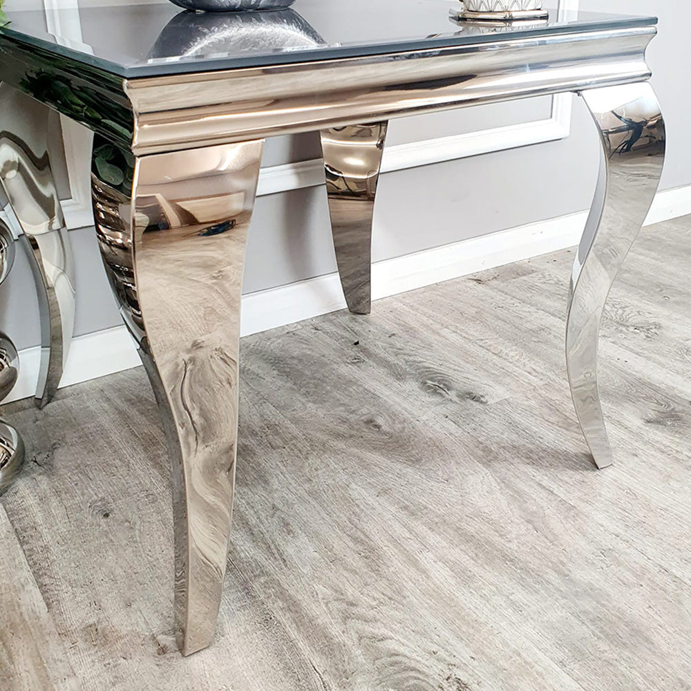Louis lamp table showing its curved legs and polished metal apron