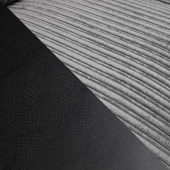Logan Fullback sofa upholstery detail showing gray ribbed fabric and dark textured material