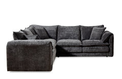 Dark gray L-shaped corner sofa with a left-side chaise, loose cushions, and textured upholstery.