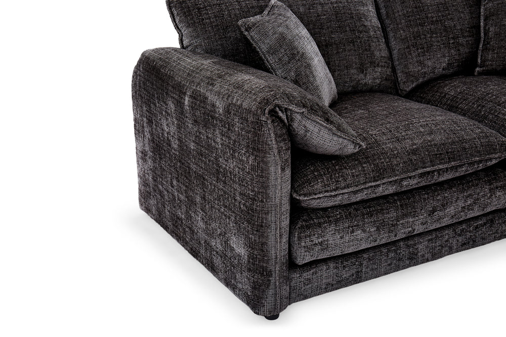 Dark gray sofa arm and seat cushion in textured fabric.