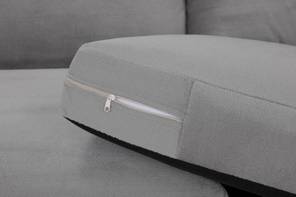 Gray sofa seat cushion with a zip fastening along the underside
