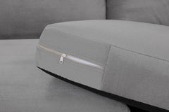 Gray sofa seat cushion with a zip fastening along the underside