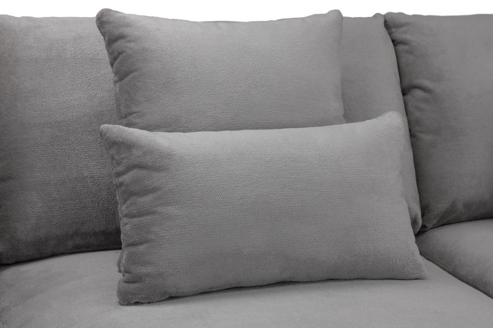 Gray scatterback sofa cushions and loose pillow in close-up