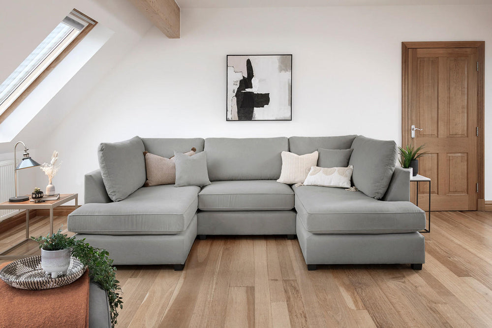 Gray U-shaped sectional sofa with chaise ends and loose back cushions